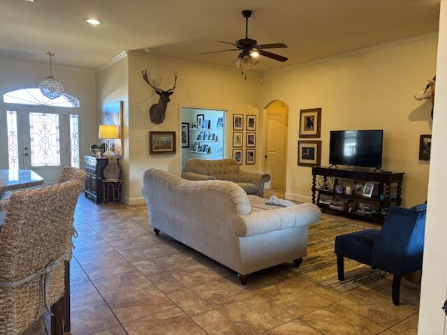 6303 112th Street Lubbock, TX 79424 - Photo 17 of 18 a living room with furniture and a flat screen tv