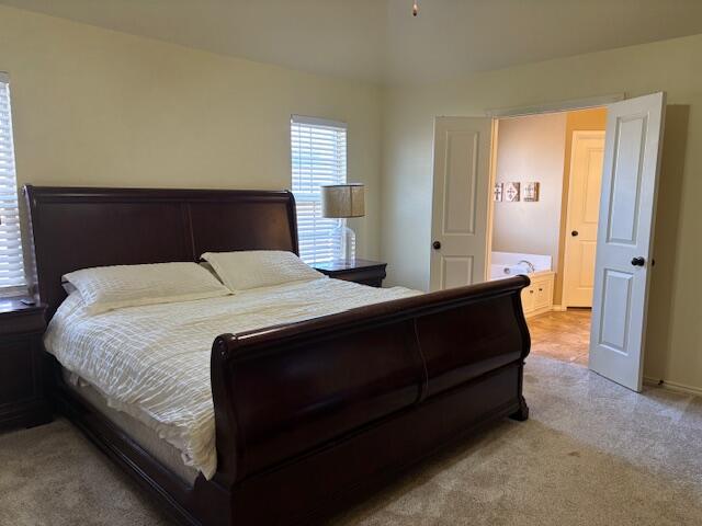 6303 112th Street Lubbock, TX 79424 - Photo 8 of 18 a bedroom with a bed and window