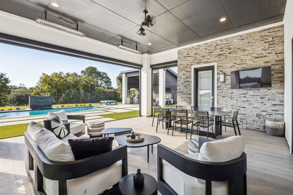 5215 Windsor Lane Copper Canyon, TX 75077 - Photo 2 of 31 2 Lift and Slide doors access patio also French door from Master