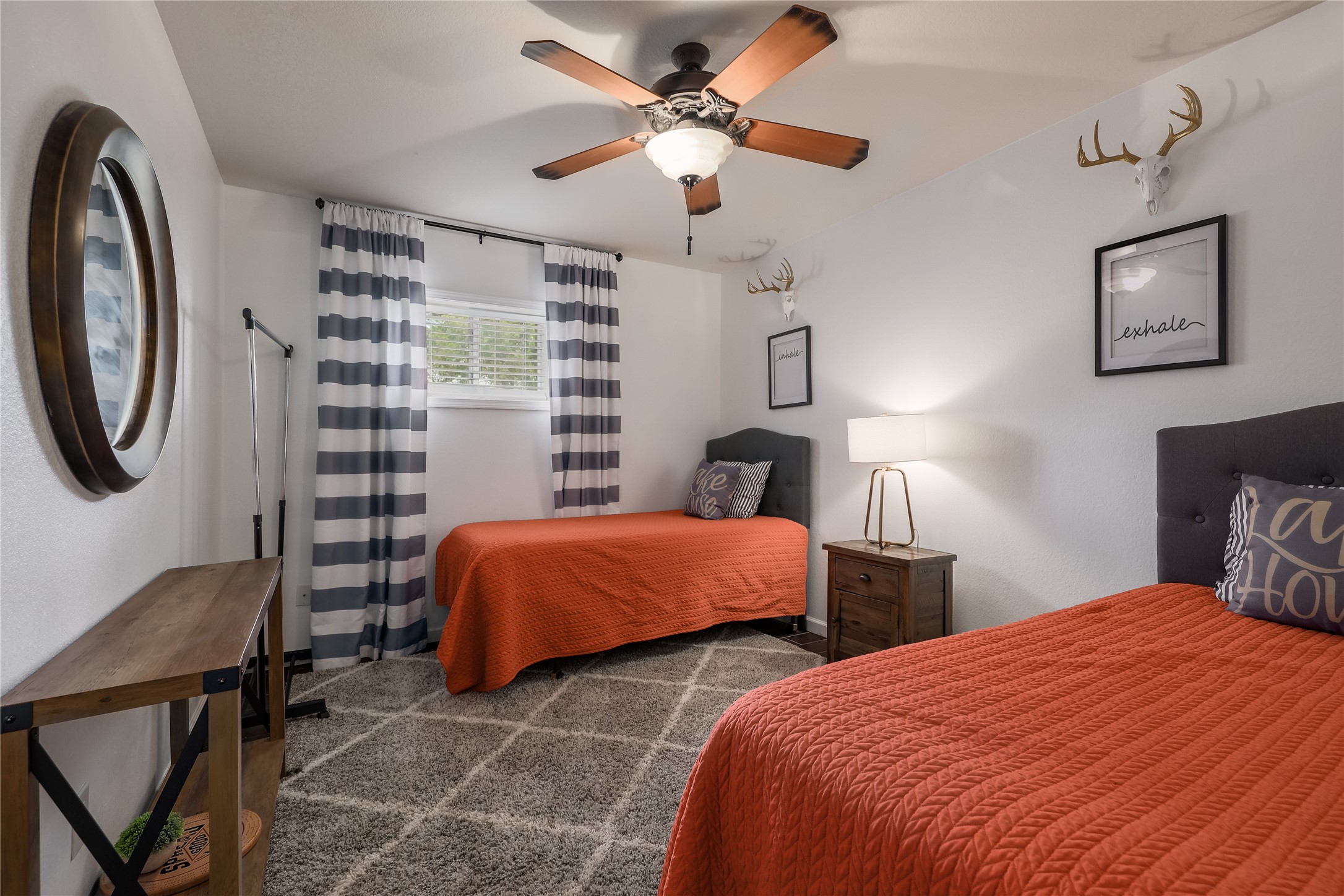 525 Ellen Williams Loop Kingsland, TX 78639 - Photo 31 of 36 a bedroom with two beds and a chandelier