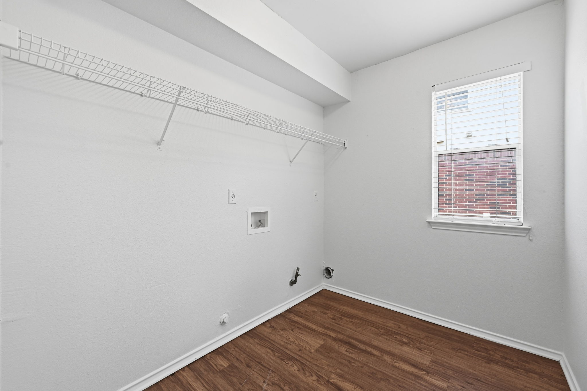 11145 Franklins Tale Loop Austin, TX 78748 - Photo 14 of 31 a view of a room with wooden floor and small window