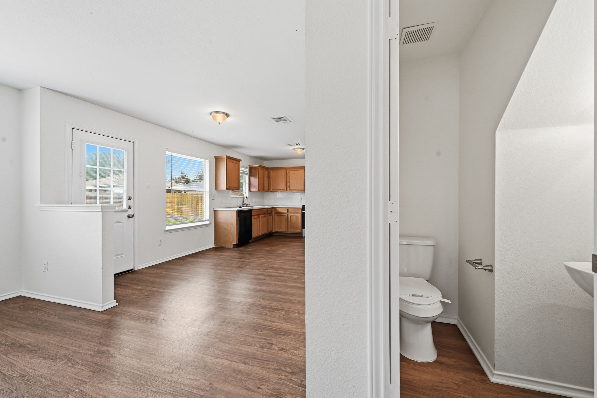 11145 Franklins Tale Loop Austin, TX 78748 - Photo 15 of 31 a view of a room with wooden floor and a bathroom