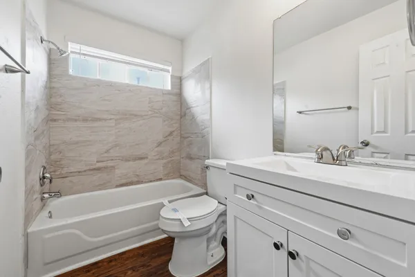 a bathroom with a sink a toilet and a bathtub
