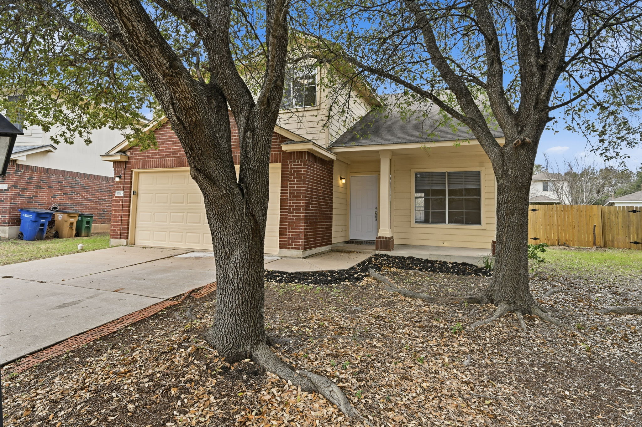 11145 Franklins Tale Loop Austin, TX 78748 - Photo 2 of 31 a house with trees in front of it