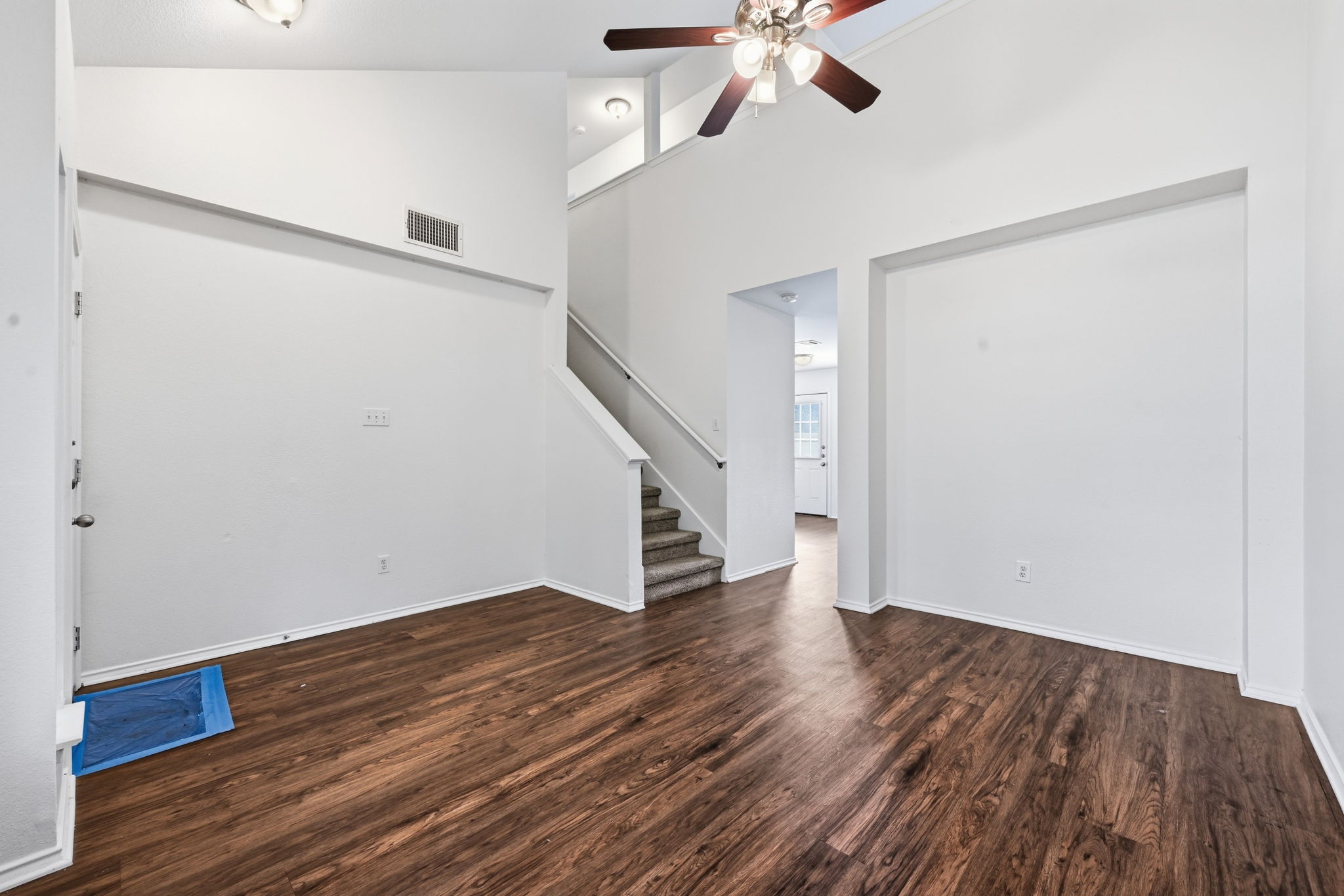 11145 Franklins Tale Loop Austin, TX 78748 - Photo 25 of 31 a view of an empty room with wooden floor and a ceiling fan