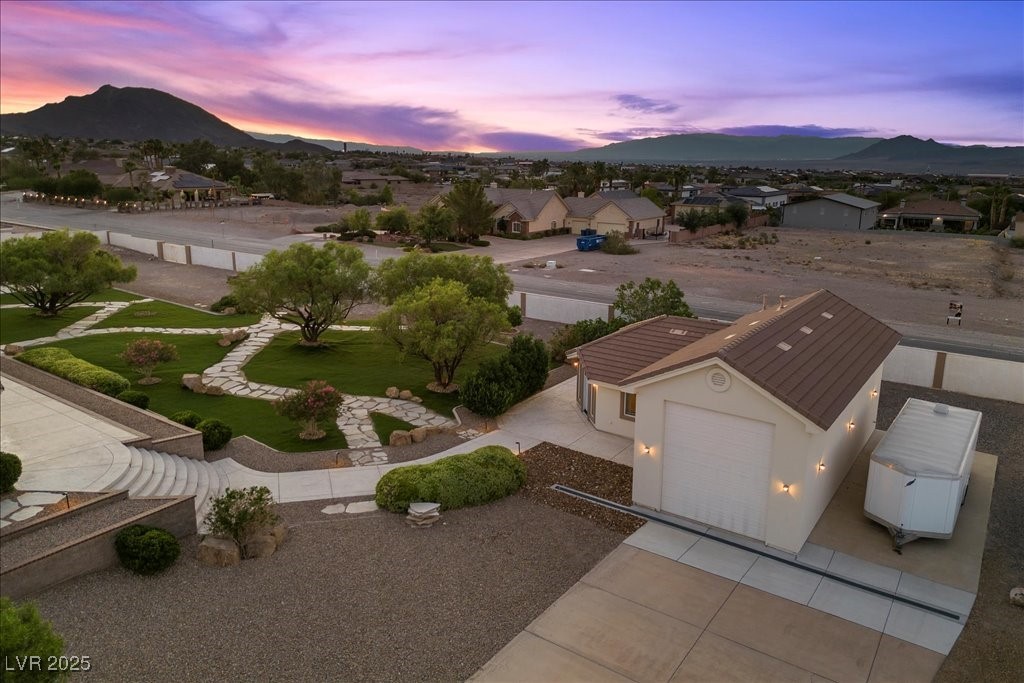 640 Quail Covey Road Henderson, NV 89002 - Photo 73 of 75 Aerial view of Guest Quarters/RV Garage property and surrounding area with mountains at dusk