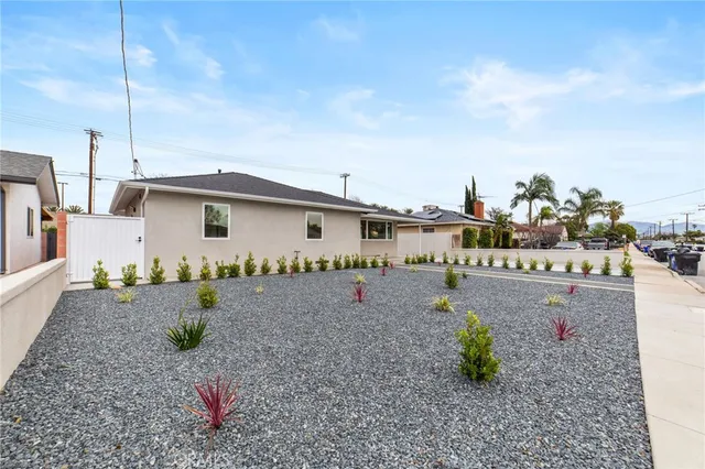 a front view of a house with garden