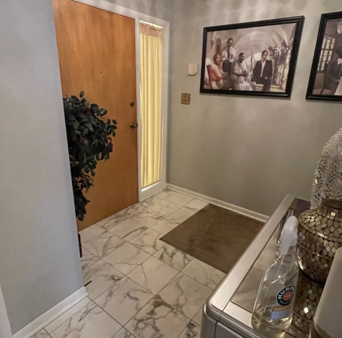 1070 South Nelson Avenue, Unit 2 Kankakee, IL 60901 - Photo 5 of 9 a view of a room with wooden floor and closet