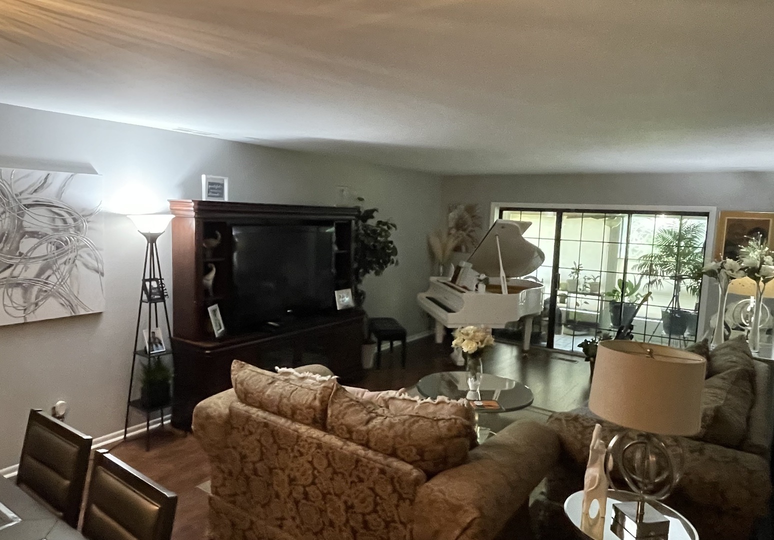 1070 South Nelson Avenue, Unit 2 Kankakee, IL 60901 - Photo 8 of 9 a living room with furniture and a floor to ceiling window