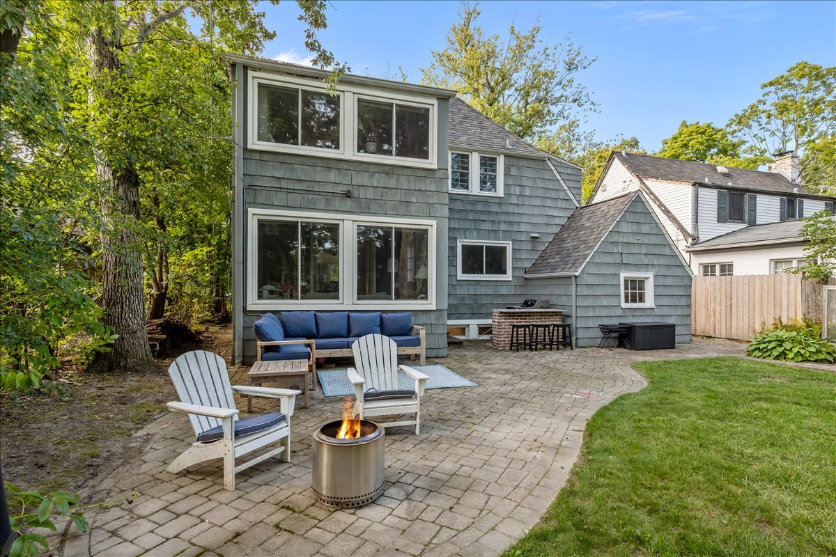 368 Woodland Road Highland Park, IL 60035 - Photo 23 of 29 a view of a house with backyard sitting area and garden