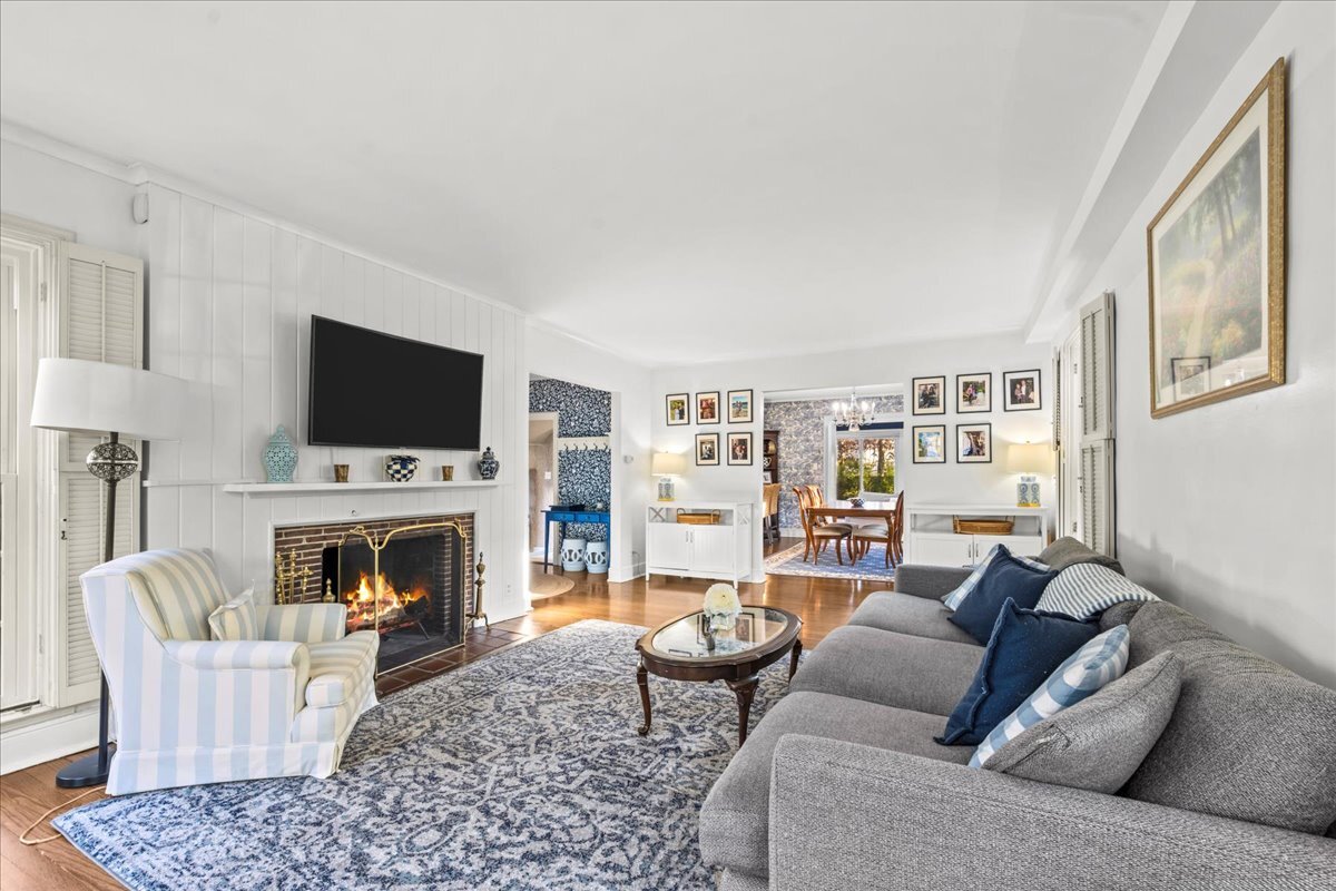368 Woodland Road Highland Park, IL 60035 - Photo 5 of 29 a living room with furniture a flat screen tv and a fireplace