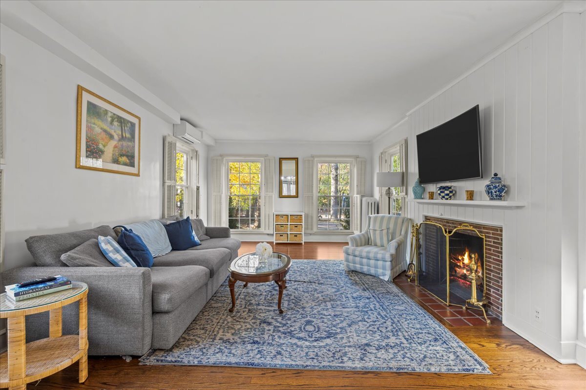 368 Woodland Road Highland Park, IL 60035 - Photo 6 of 29 a living room with furniture a rug and a fireplace