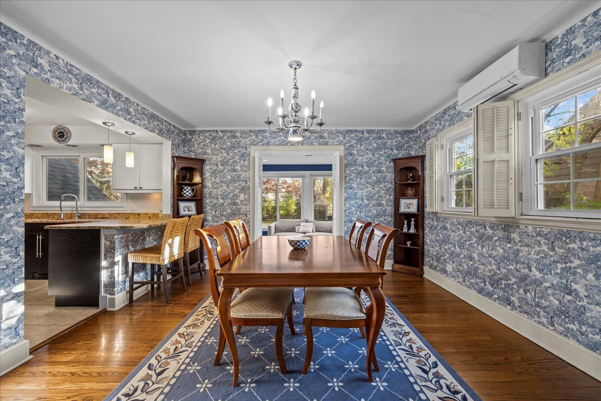 368 Woodland Road Highland Park, IL 60035 - Photo 10 of 29 a dining room with furniture a rug and a chandelier