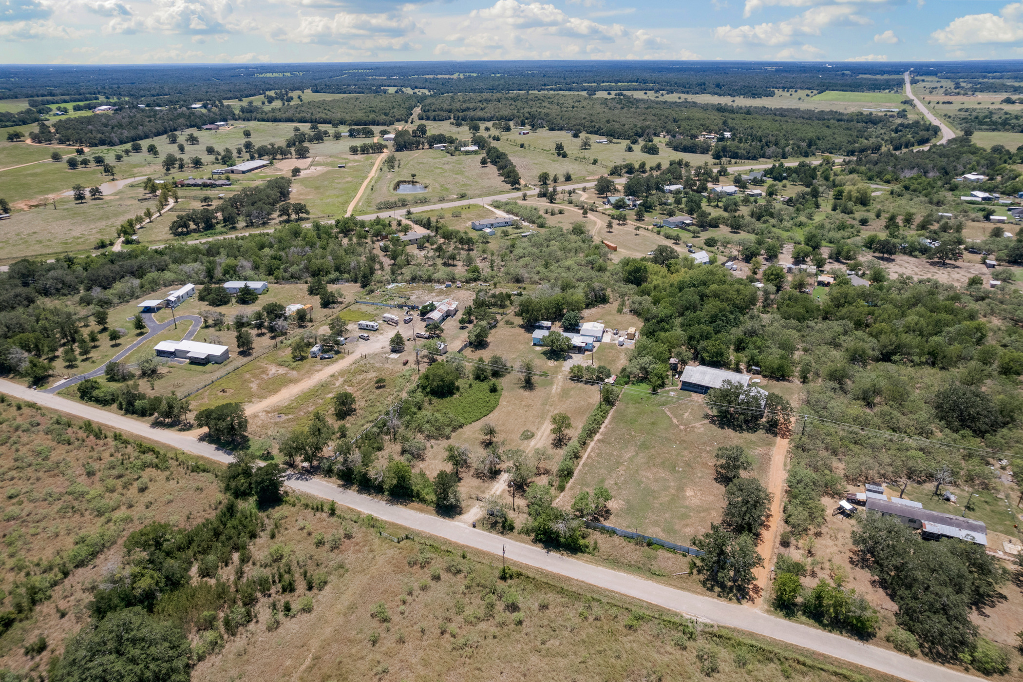 147 Community Center Road Rosanky, TX 78953 - Photo 2 of 33 Aerial view of property's location with rural landscape