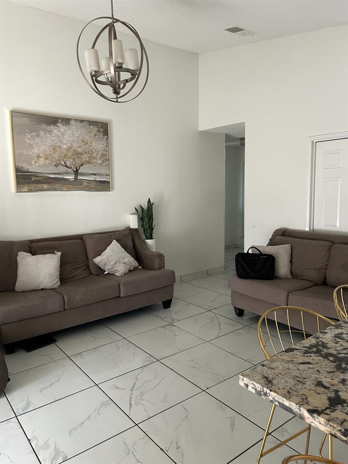 629 E Fort Modesto, CA 95354 - Photo 7 of 16 a living room with furniture and a table