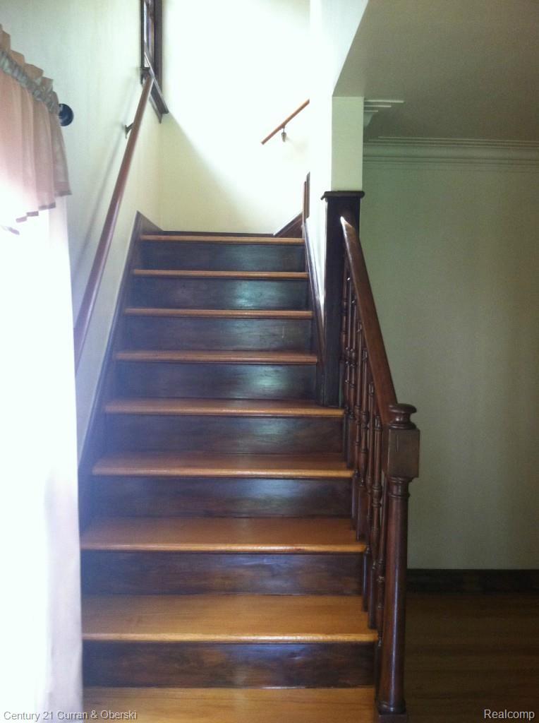 14943 Stahelin Road Detroit, MI 48223 - Photo 10 of 16 Hardwood stairs lead to the 2nd level