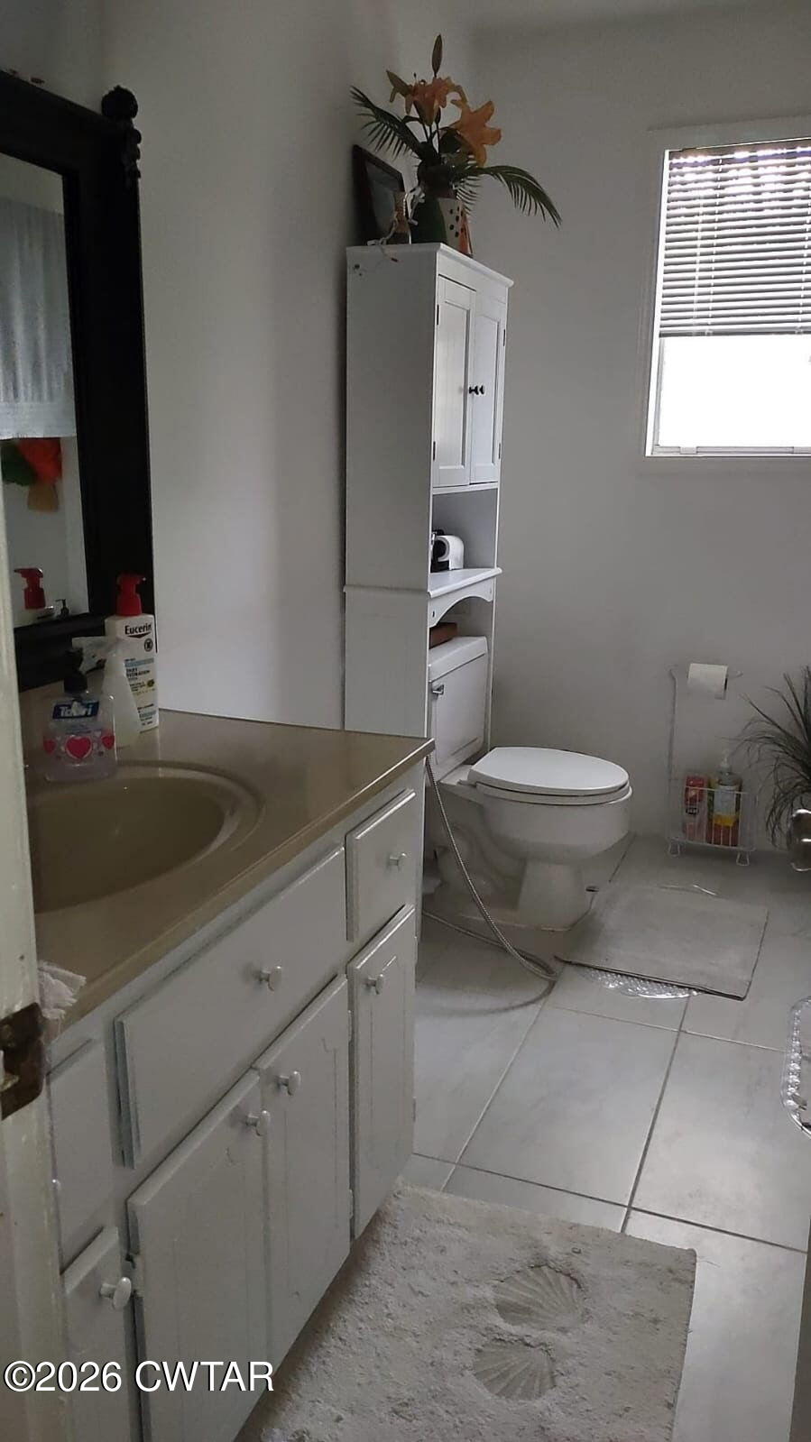 195 Ridge Road Medina, TN 38355 - Photo 12 of 14 a bathroom with a toilet sink and mirror