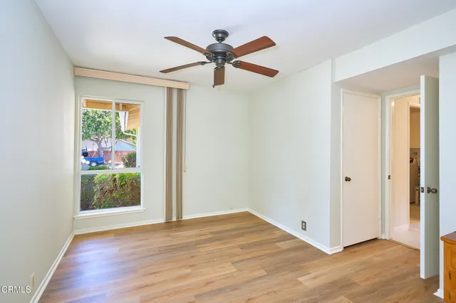 wooden floor in a hall with an empty room