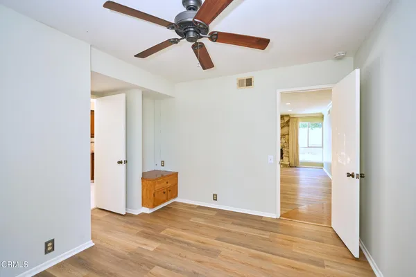 a kitchen with stainless steel appliances granite countertop a sink and a refrigerator