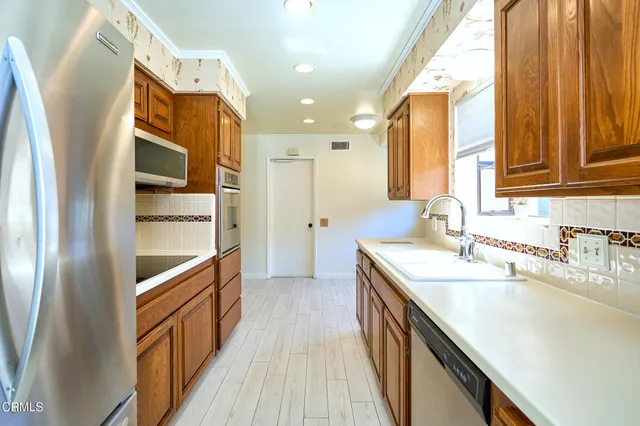 a bathroom with a double vanity sink a mirror and a bathtub