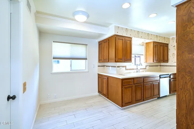 a bathroom with a sink a mirror and a shower