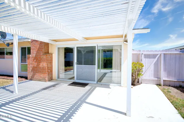 a view of a swimming pool with a porch