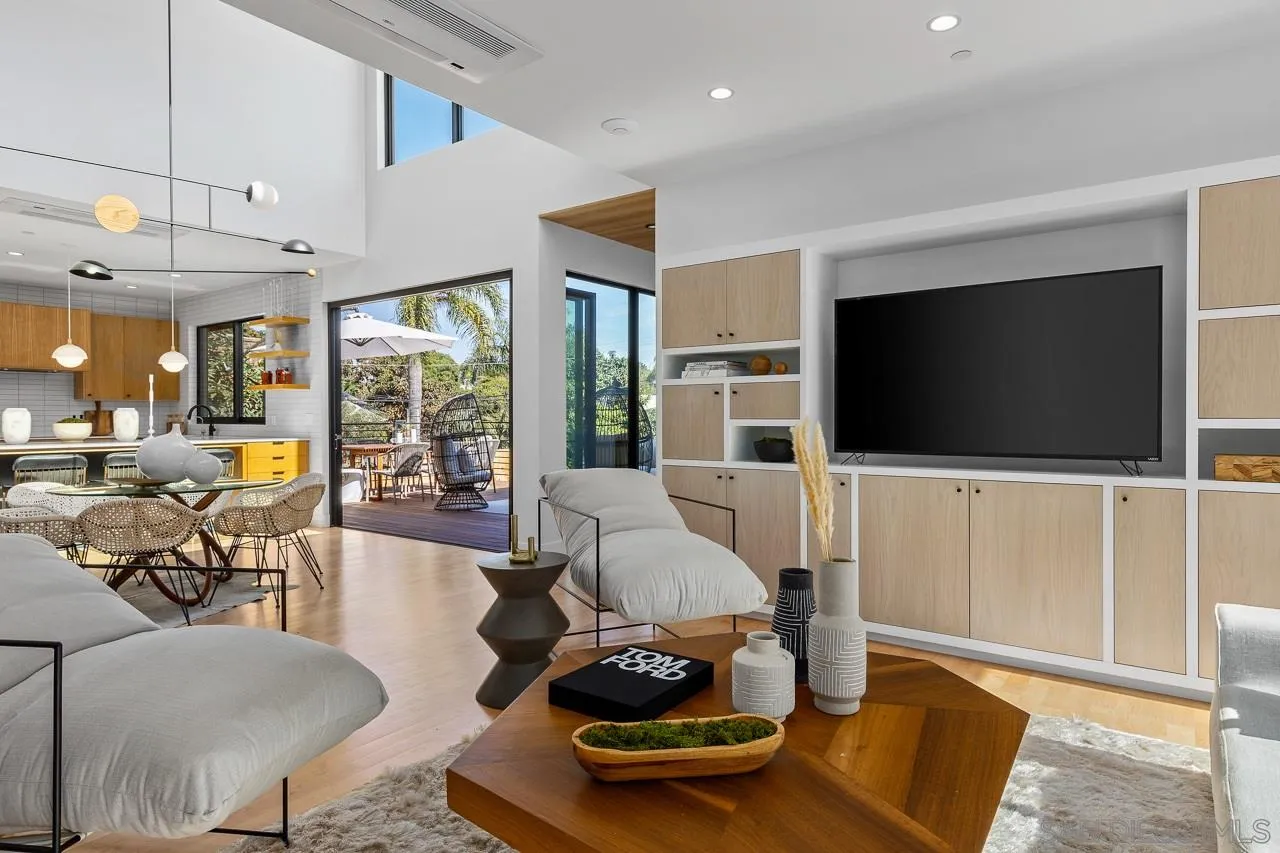 605 Cornish Drive Encinitas, CA 92024 - Photo 12 of 32 a living room with furniture and a flat screen tv
