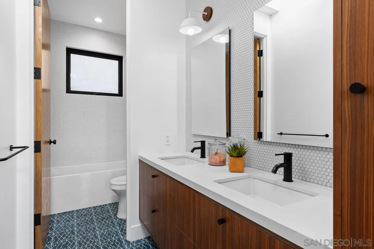 605 Cornish Drive Encinitas, CA 92024 - Photo 20 of 32 a bathroom with a sink a toilet and shower