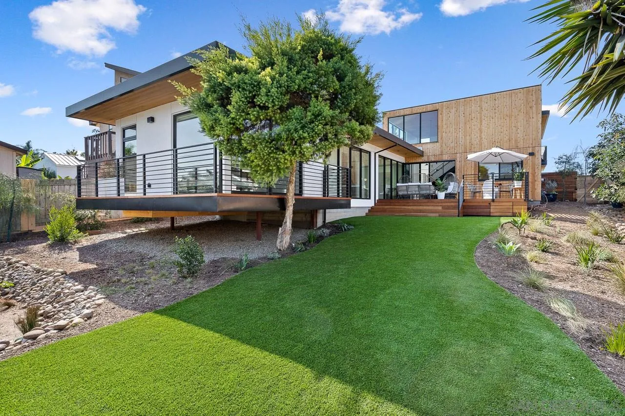 605 Cornish Drive Encinitas, CA 92024 - Photo 26 of 32 a front view of a house with garden and sitting area