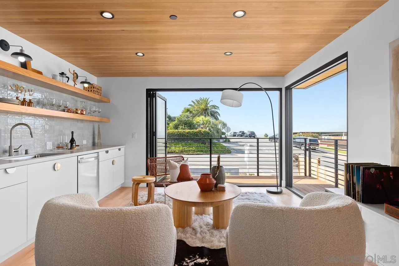 605 Cornish Drive Encinitas, CA 92024 - Photo 28 of 32 a living room with furniture and a large window
