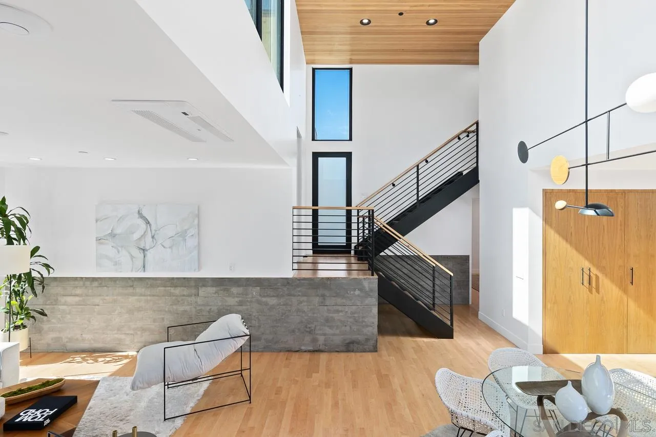 605 Cornish Drive Encinitas, CA 92024 - Photo 3 of 32 a living room with furniture and a wooden floor
