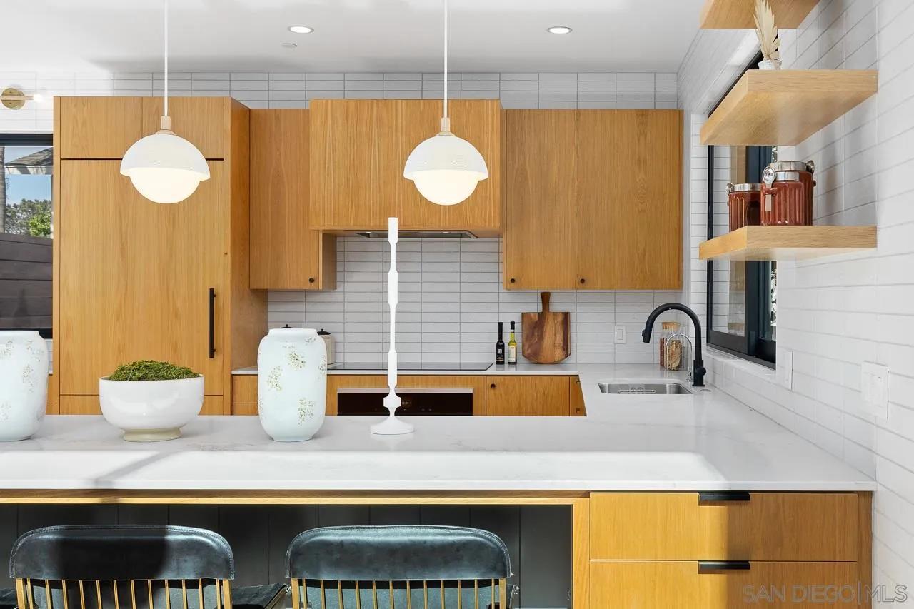 605 Cornish Drive Encinitas, CA 92024 - Photo 10 of 32 a kitchen with a sink and a stove