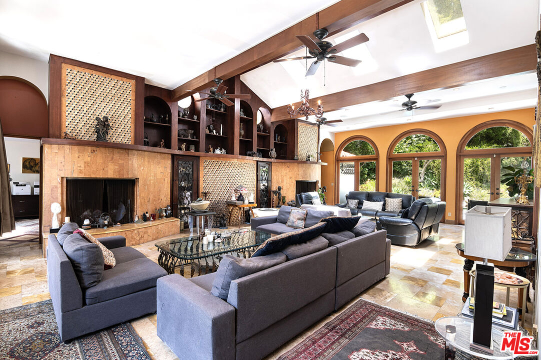 1260 Roscomare Road Los Angeles, CA 90077 - Photo 16 of 75 a living room with fireplace furniture and a fireplace