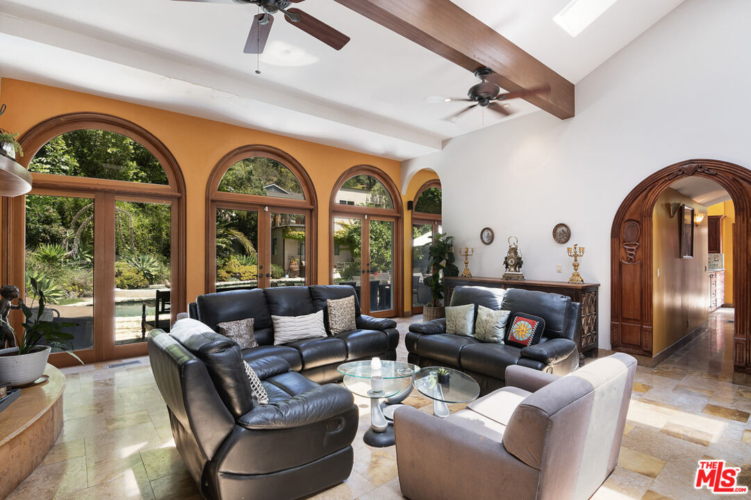 1260 Roscomare Road Los Angeles, CA 90077 - Photo 18 of 75 a living room with furniture and a large window