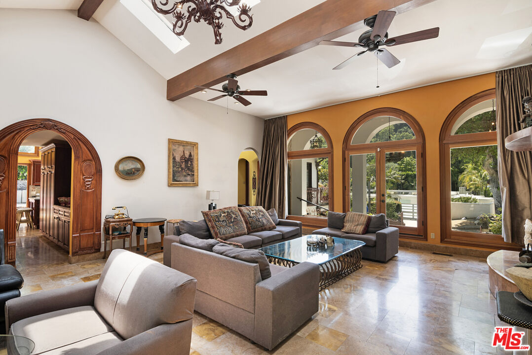 1260 Roscomare Road Los Angeles, CA 90077 - Photo 19 of 75 a living room with furniture and a large window