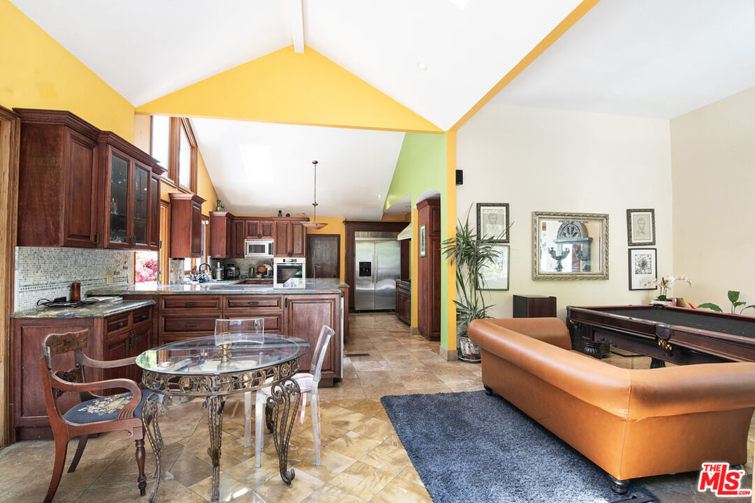 1260 Roscomare Road Los Angeles, CA 90077 - Photo 29 of 75 a living room with furniture and a kitchen