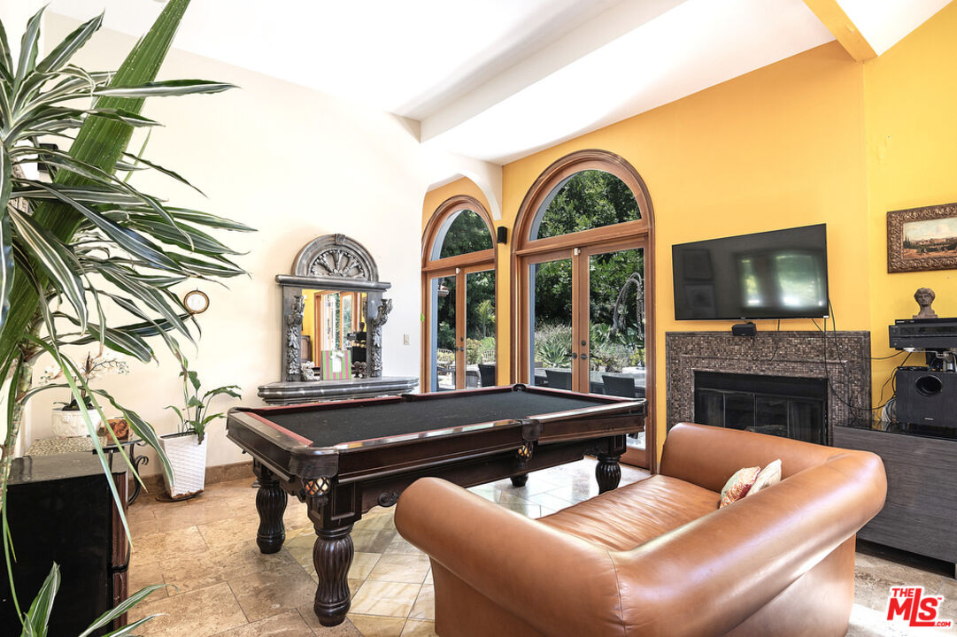1260 Roscomare Road Los Angeles, CA 90077 - Photo 32 of 75 a living room with fireplace furniture and a fireplace