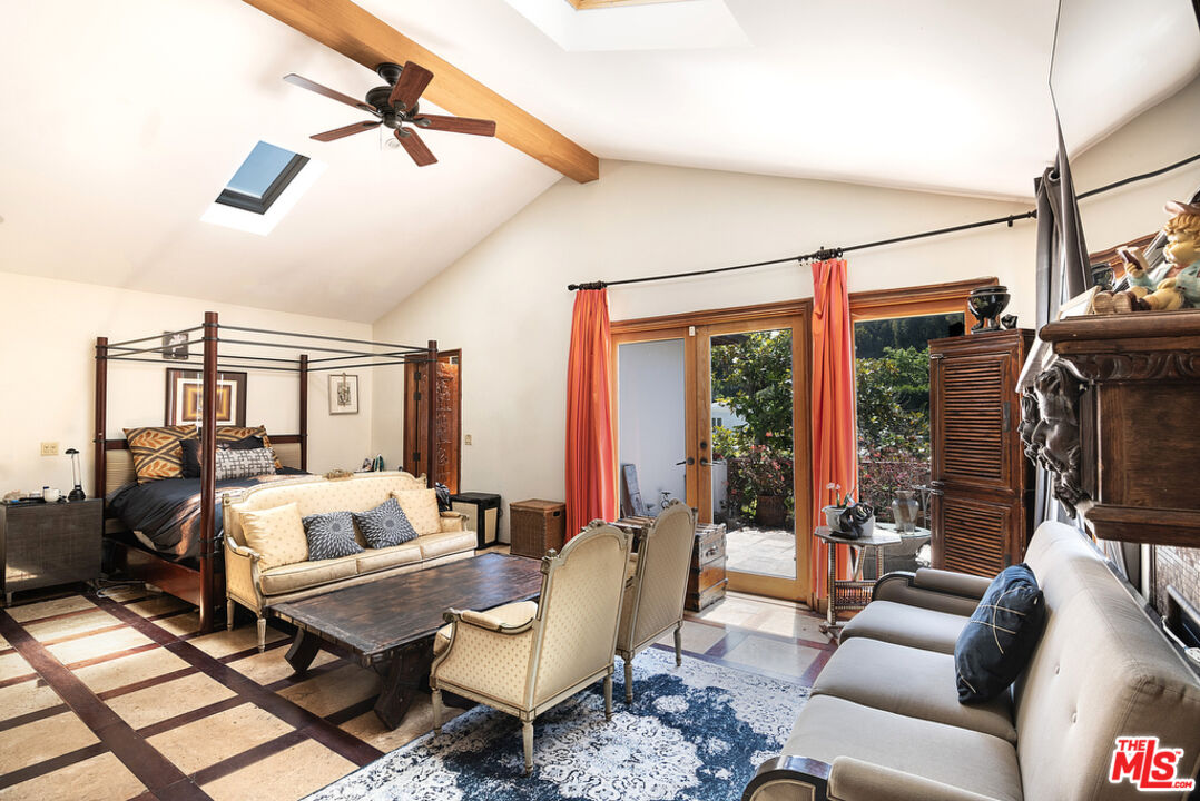 1260 Roscomare Road Los Angeles, CA 90077 - Photo 33 of 75 a living room with furniture and floor to ceiling windows