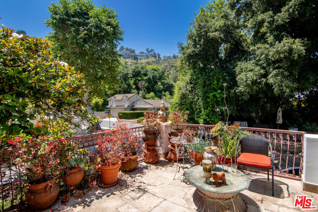 1260 Roscomare Road Los Angeles, CA 90077 - Photo 34 of 75 a view of a patio with chairs and plants