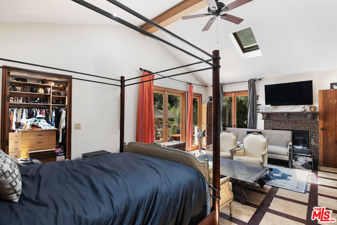 1260 Roscomare Road Los Angeles, CA 90077 - Photo 37 of 75 a bedroom with a bed couch and a window