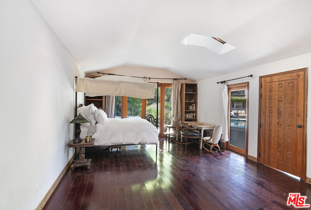 1260 Roscomare Road Los Angeles, CA 90077 - Photo 41 of 75 a living room with furniture and a wooden floor