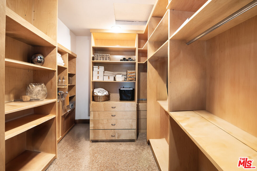 1260 Roscomare Road Los Angeles, CA 90077 - Photo 44 of 75 a view of walk in closet and bedroom