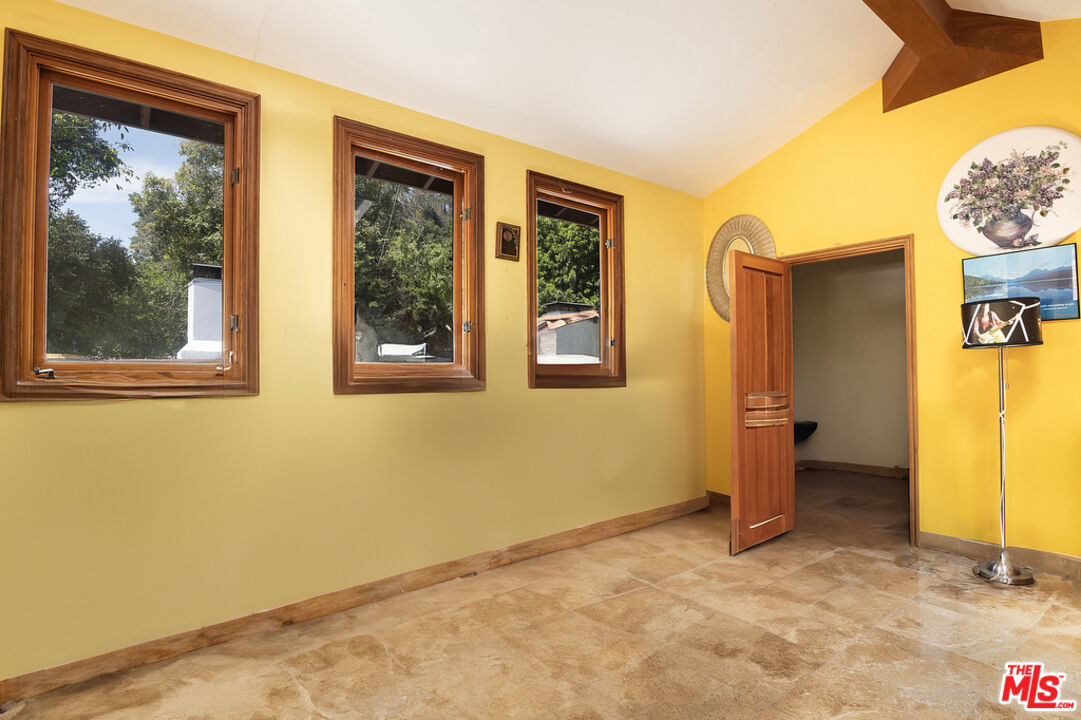 1260 Roscomare Road Los Angeles, CA 90077 - Photo 47 of 75 a view of an empty room with a window