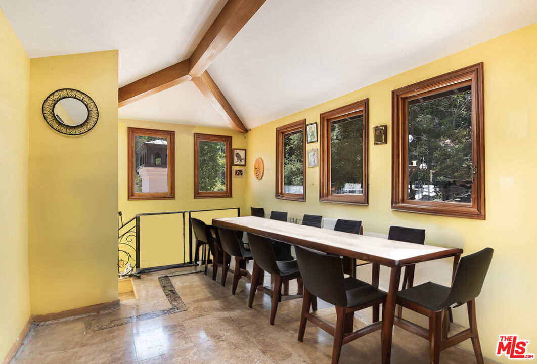 1260 Roscomare Road Los Angeles, CA 90077 - Photo 49 of 75 a view of a dining room with furniture and window