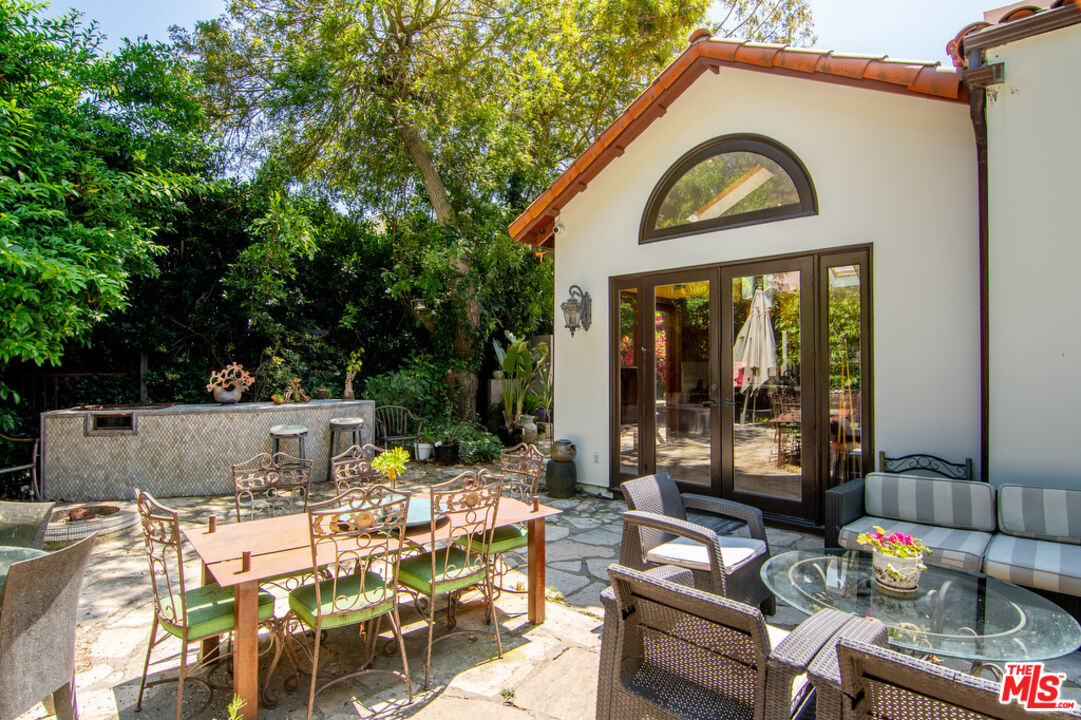 1260 Roscomare Road Los Angeles, CA 90077 - Photo 56 of 75 a view of a chairs and table in a patio