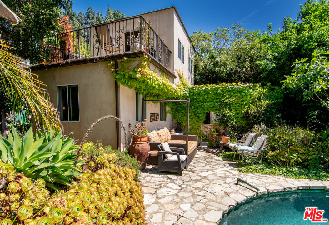 1260 Roscomare Road Los Angeles, CA 90077 - Photo 61 of 75 a view of a patio with table and chairs and potted plants