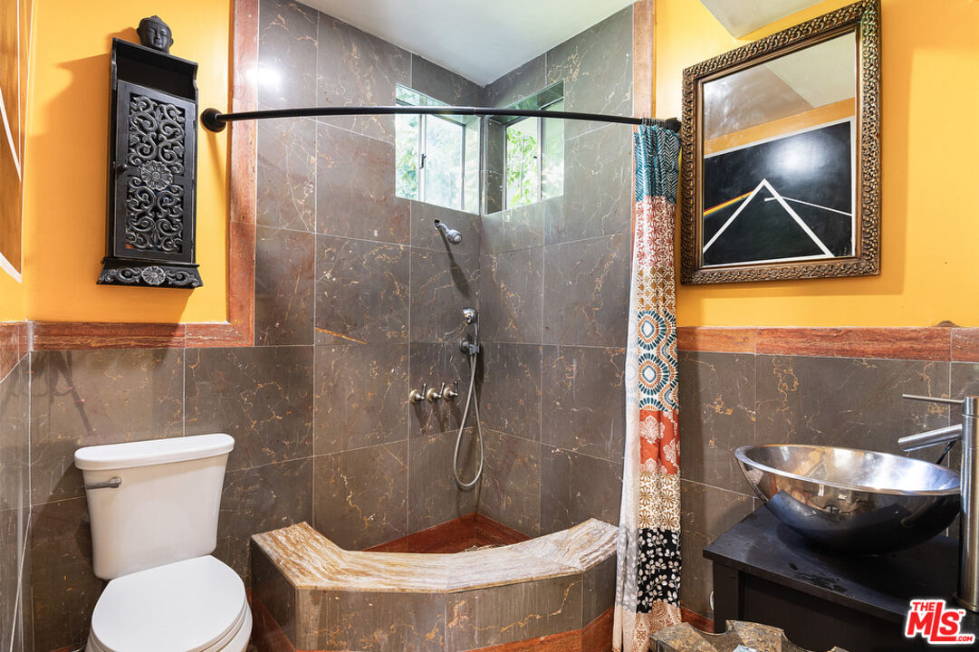 1260 Roscomare Road Los Angeles, CA 90077 - Photo 63 of 75 a bathroom with a toilet and a shower