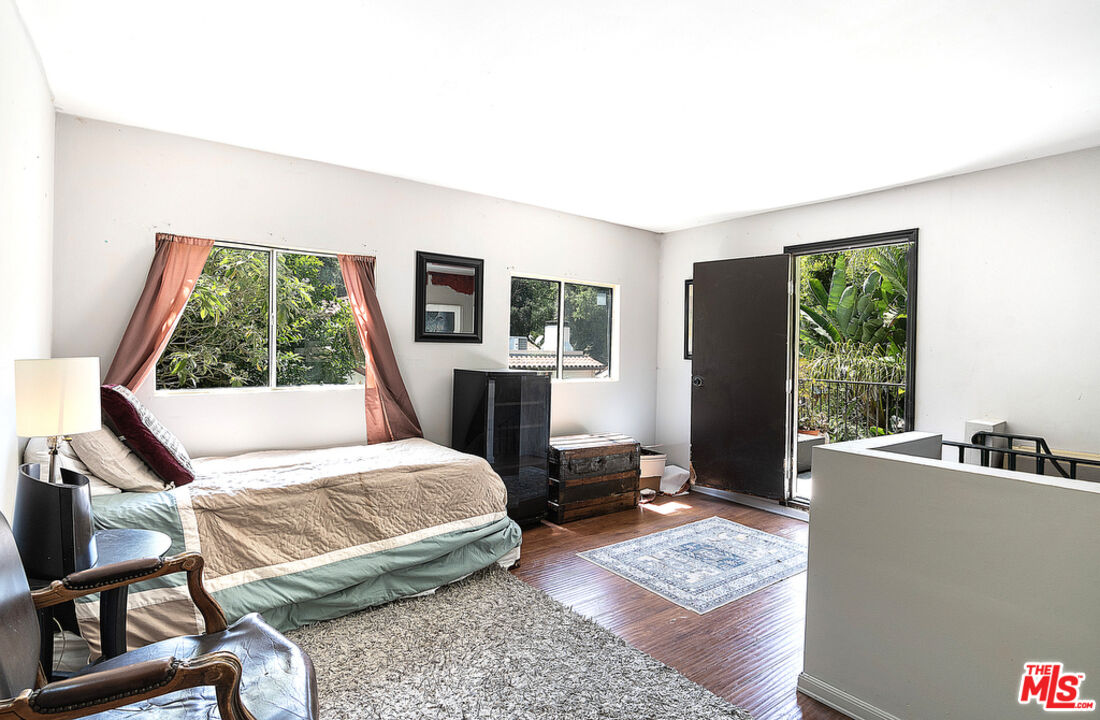 1260 Roscomare Road Los Angeles, CA 90077 - Photo 66 of 75 a bedroom with a bed and a window