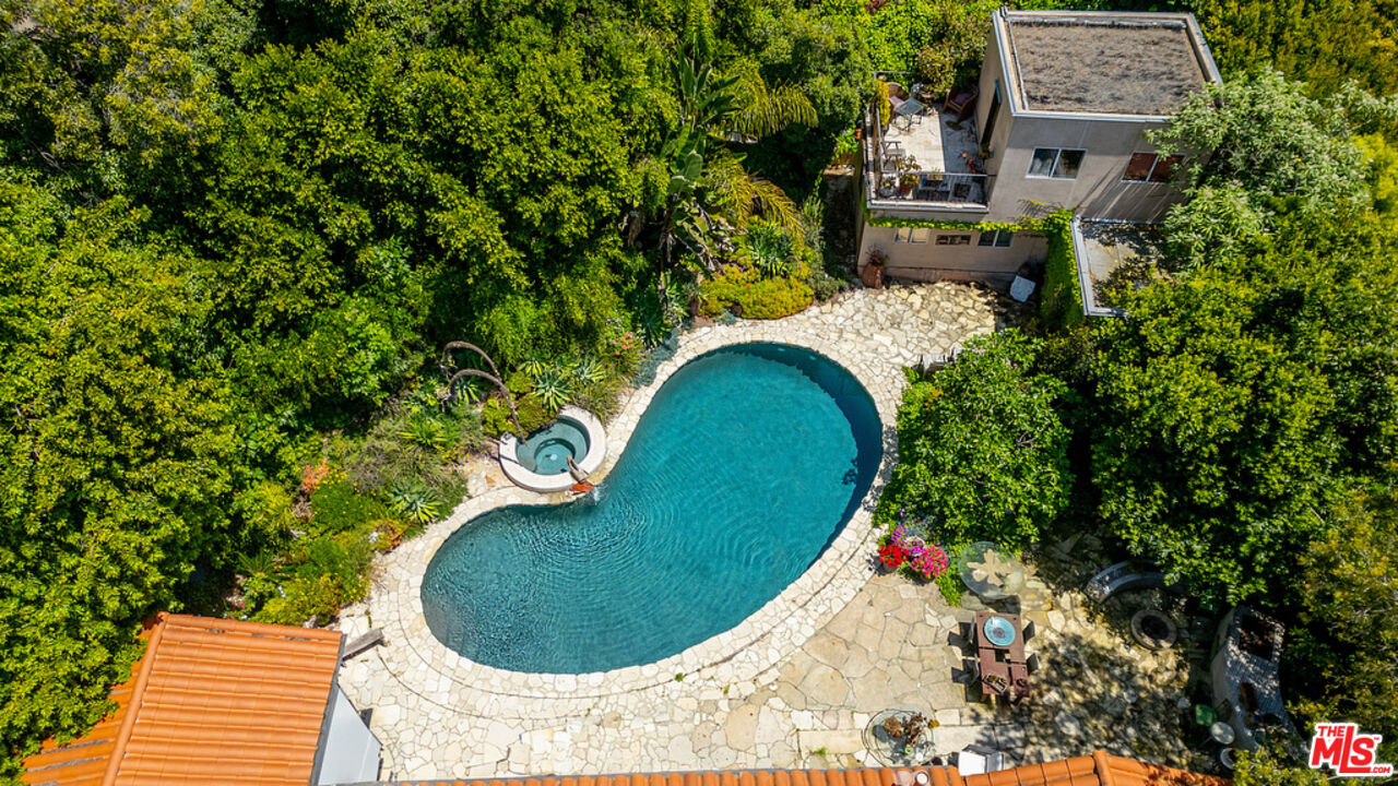 1260 Roscomare Road Los Angeles, CA 90077 - Photo 69 of 75 an aerial view of a house with swimming pool and trees