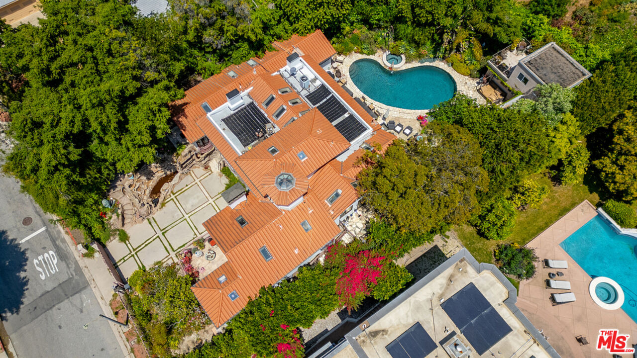1260 Roscomare Road Los Angeles, CA 90077 - Photo 70 of 75 an aerial view of a house with a yard and lake view